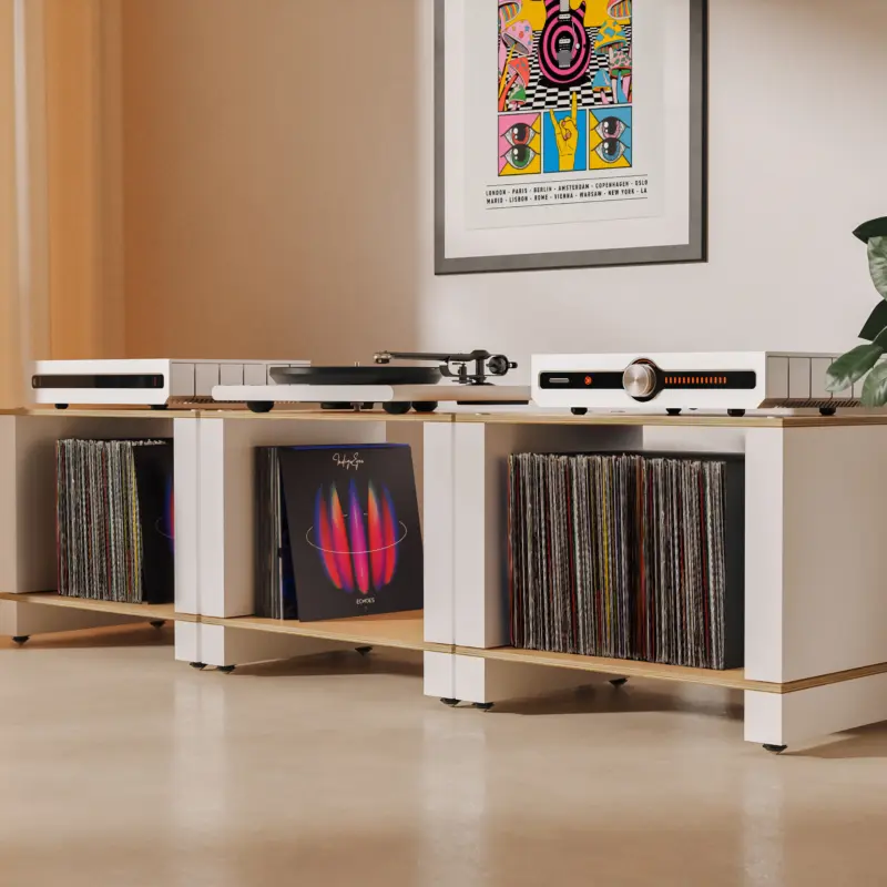 The Blok Stax 2G LP Collection in a row of three, holding records beneath a turntable and electronics