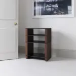 Stax 2G rack in black ash plywood with natural walnut supports in a living room