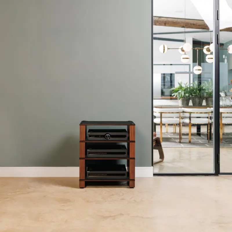 Stax 2G rack in black ash plywood with natural walnut supports in an open-plan room