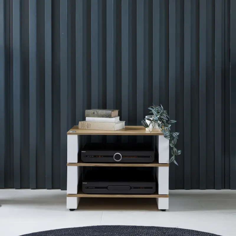 Stax 2G Base and two shelves in natural ash and satin white, holding electronics against a dark panelled wall