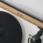 Turntable resting on a natural ash shelf with the Blok logo in the plywood